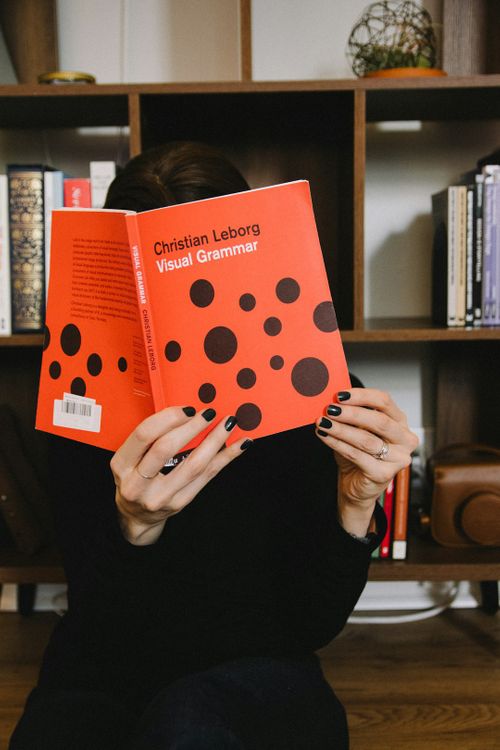 person-holding-orange-and-white-polka-dot-paper-sX_OIy4_HF8.jpg