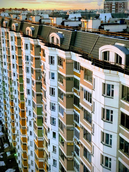 high-angle-photography-of-white-and-brown-high-rise-building-during-daytime-Dda0a5M0MtY.jpg