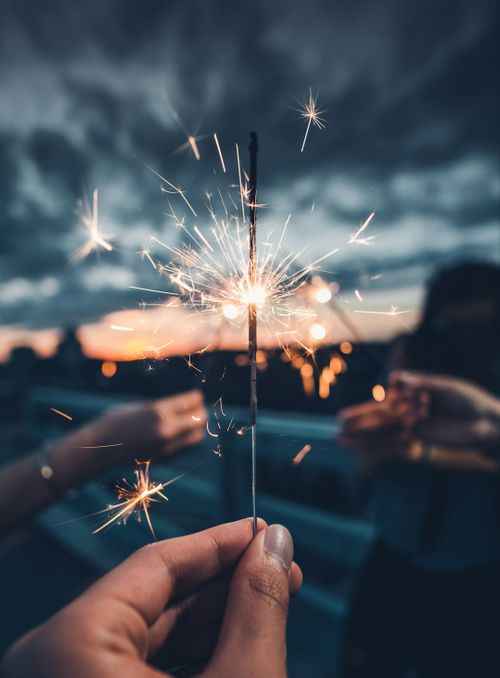 photo-of-person-holding-lighted-sparkler-kMRMcUcO81M.jpg